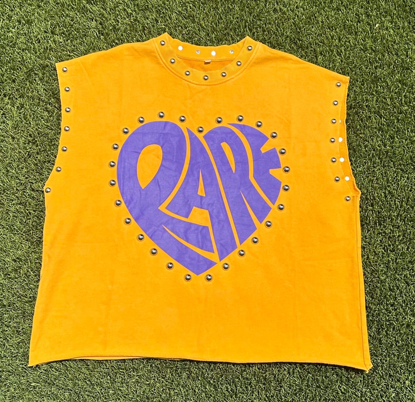 Yellow studded sleeveless top with purple 'RARE'